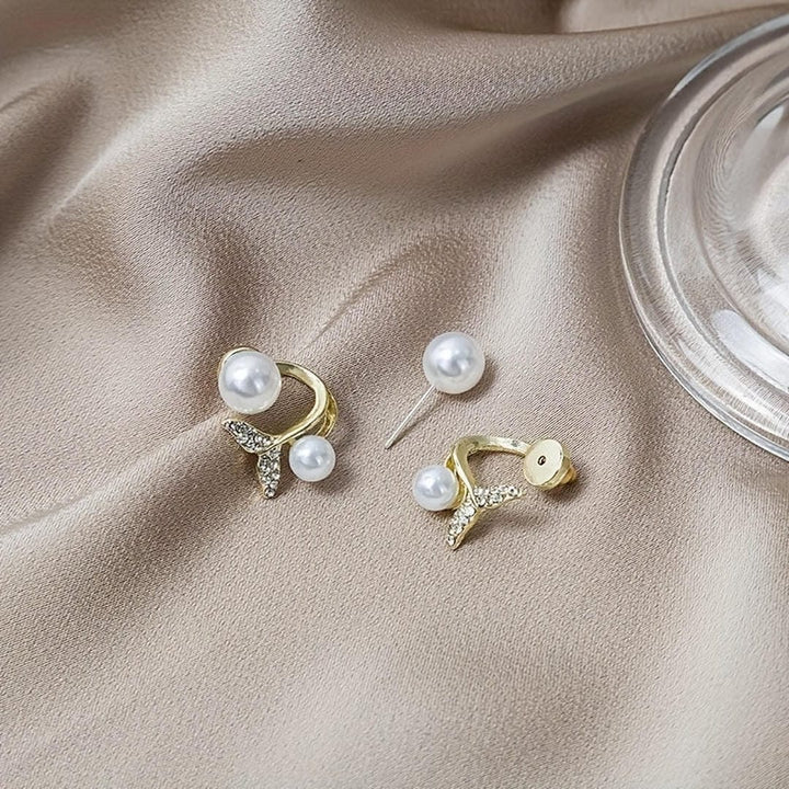 Gold Stud Earrings with Pearl and Whale Tail Motif