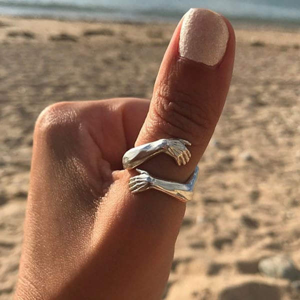 Sterling Silver Ring with Embracing Hands Motif