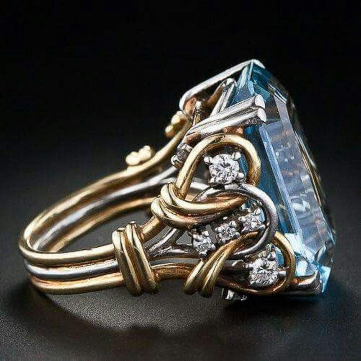 Gold &amp; Silver Ring Bláthnaid with Blue Zircon