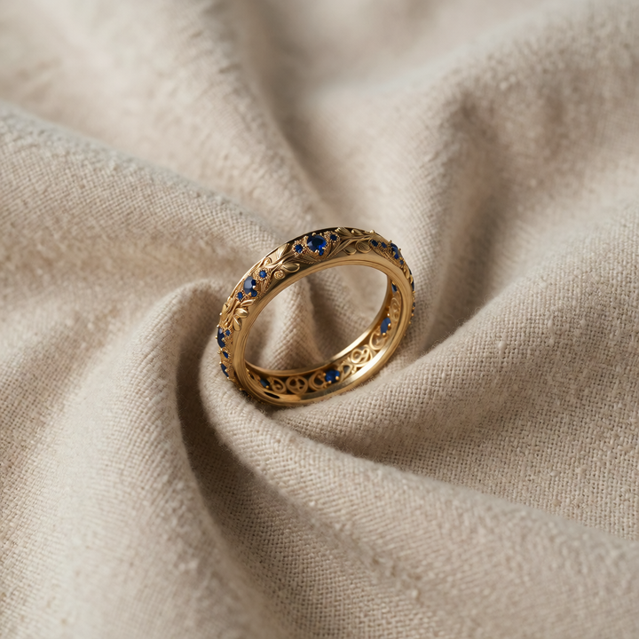 Gold Eternity Ring with Blue Sapphire and Floral Motif