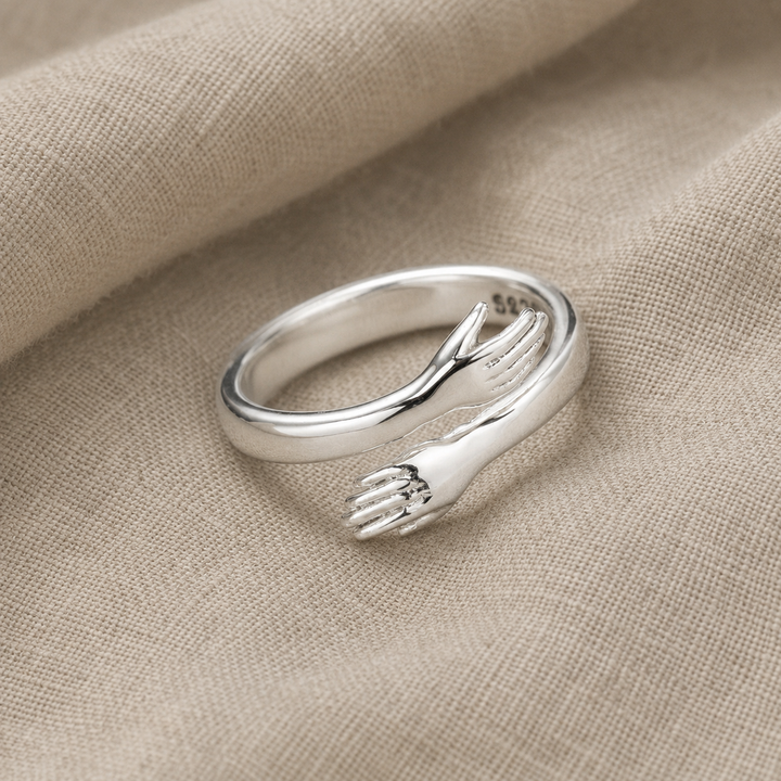 Sterling Silver Ring with Embracing Hands Motif