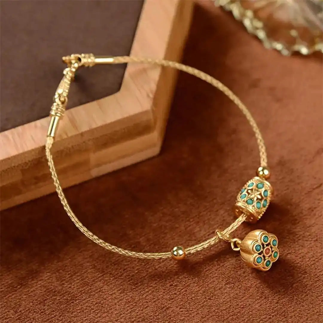 Gold Bangle Treasa with Turquoise Flower Charms