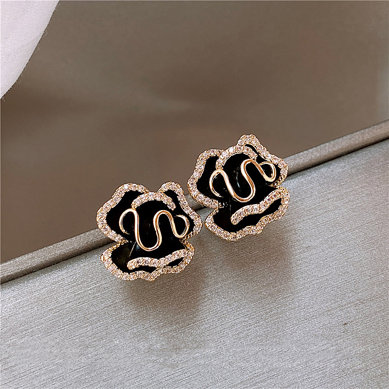 Gold Stud Earrings Órlaith with Black Lotus Flower