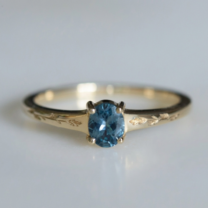 Gold Ring Sorcha with Blue Topaz &amp; Leaf Motif